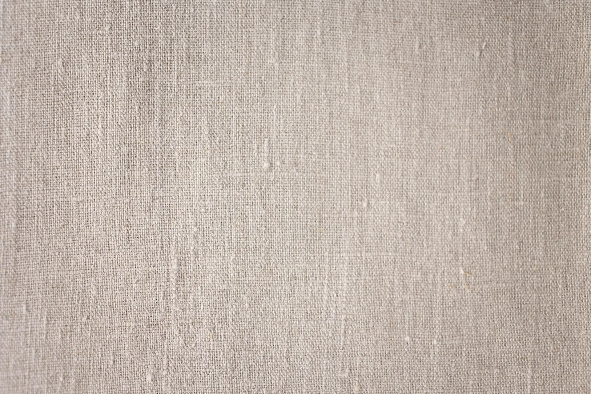 Close-up of tactile neutral linen textile weave